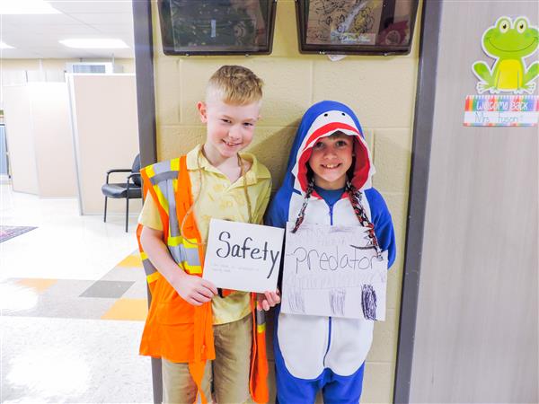 Students and teachers dressing up for a vocabulary parade. 